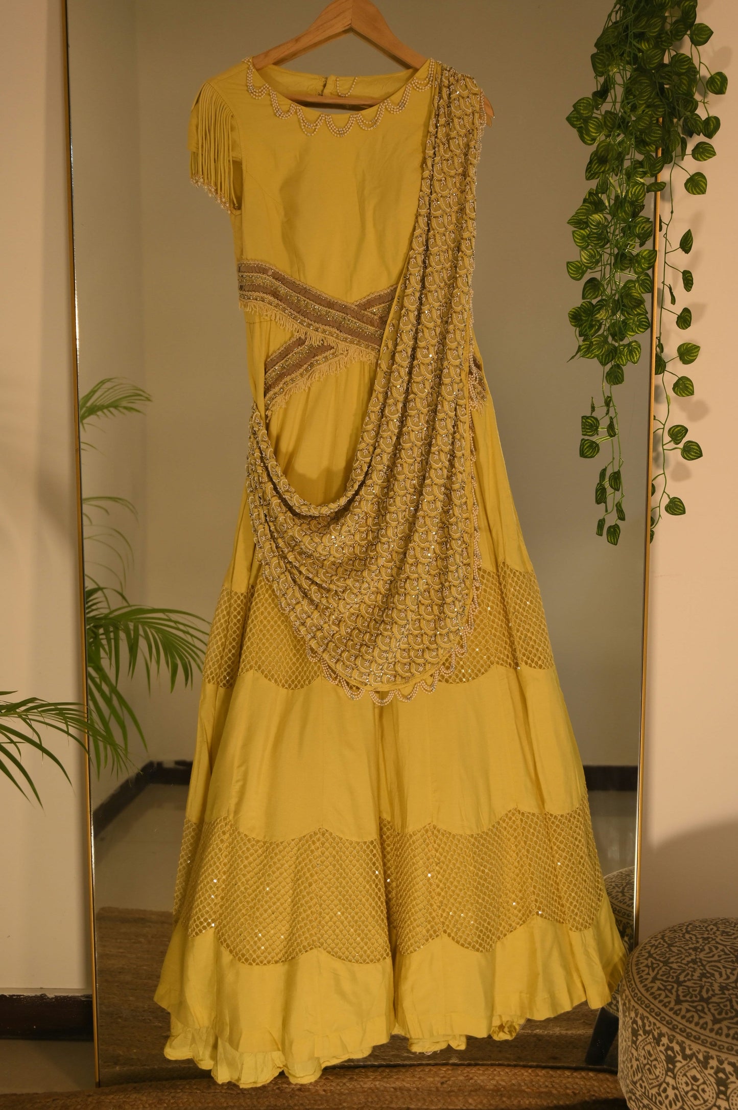 Yellow heavily embellished gown with drapes