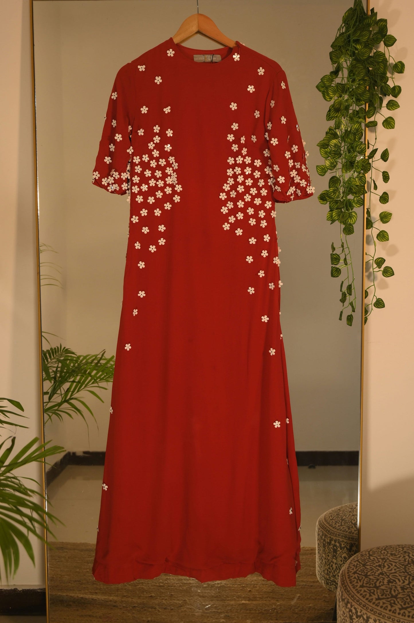 Flower embellished red gown