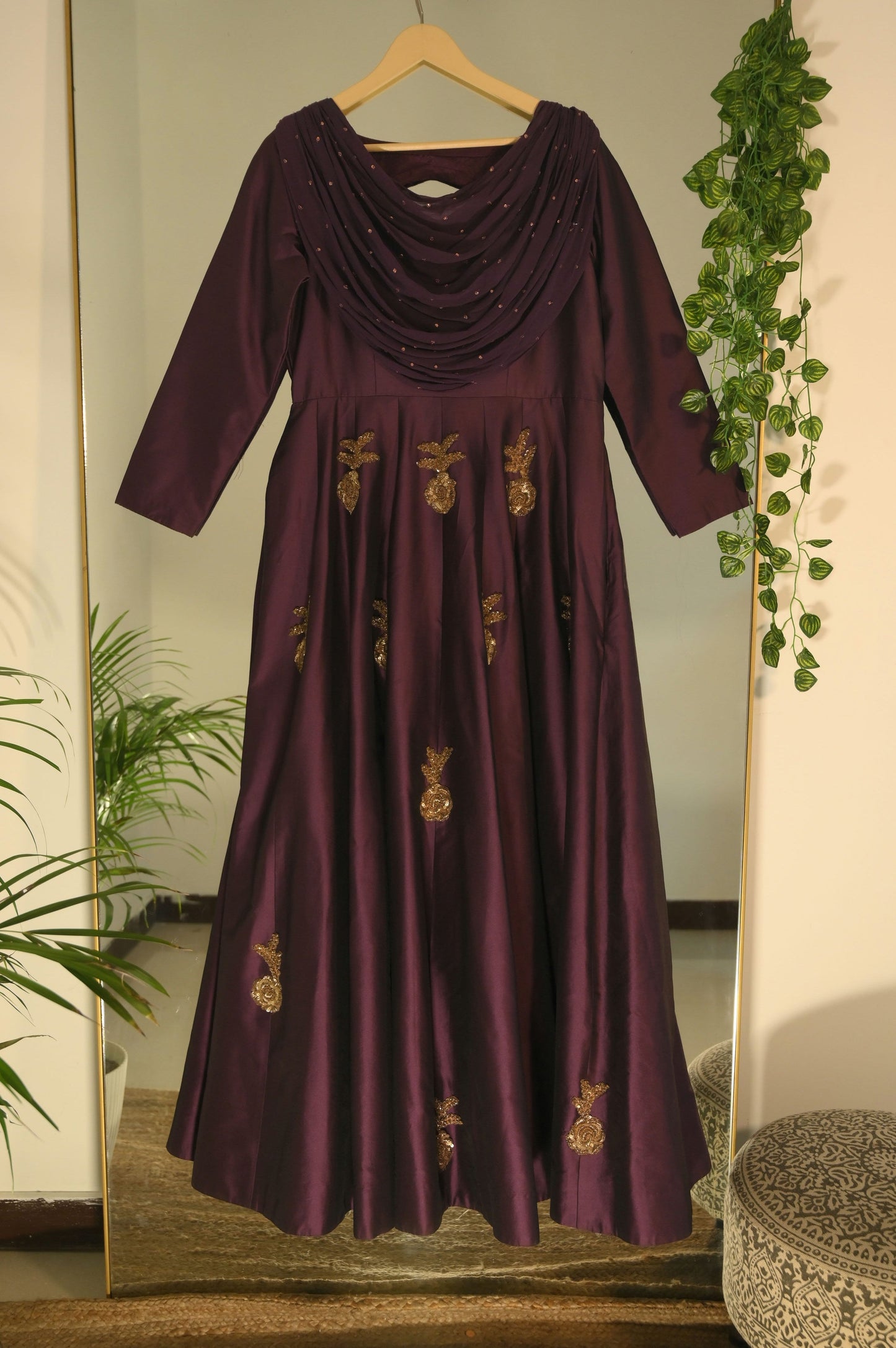 Plum gown with drape detailing